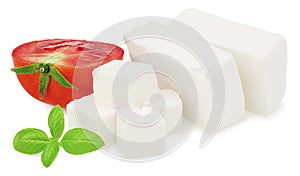 Slices feta cheese with tomato and basil isolated on white background. Clipping path and full depth of field