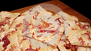 Slices of Flambee pie - a French specialty called Tarte flambee