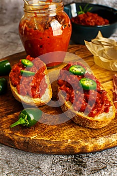 Slices of fresh bread spread with homemade lutenica