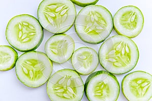 Slices of fresh green cucumber. isolated white background