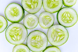 Slices of fresh green cucumber. isolated white background