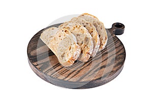 Slices of fresh rye bread on a round wooden board