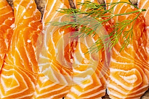 Slices of fresh salmon. Ingredient for cooking healthy seafood. Concept omega 3 containing food