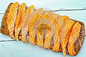 Slices of fresh salmon. Ingredient for cooking healthy seafood. Concept omega 3 containing food