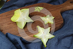 Slices of fresh star fruit. Carambola on a cutting board.