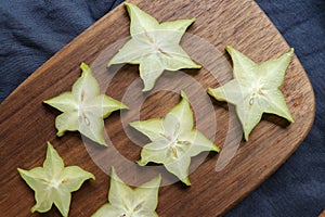 Slices of fresh star fruit. Carambola on a cutting board.