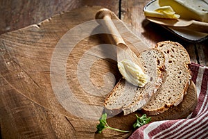 Slices of freshly baked rye bread on cutting board