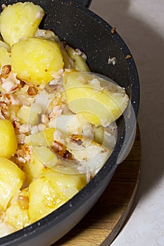 Slices of fried potato with pork