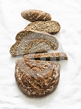 Slices of gluten-free homemade bread on a light background, top view. Healthy food diet concept