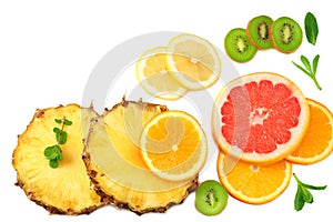 slices of grapefruit, kiwi fruit, orange and pineapple isolated on white background top view healthy background
