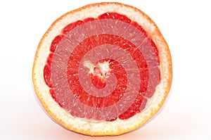 Slices of grapefruit macro closeup on white background