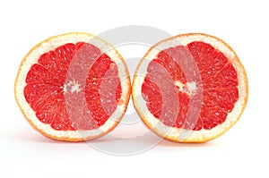 Slices of grapefruit macro closeup on white background