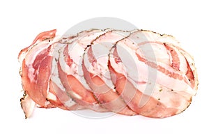 Slices of Guanciale, italian cured meat made from pork jowl, on white background.