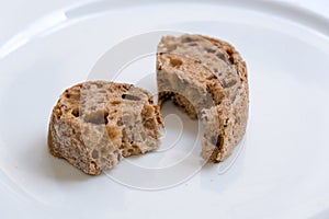 Slices of healthy and nutricious brown bread on a plate photo