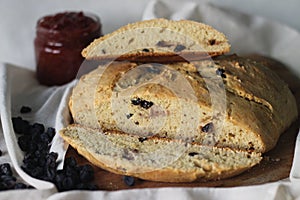 Slices of home baked Irish soda bread with raisins. A quick bread to make at home with out yeast. Served with fig jam