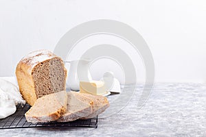 Slices of homemade no knead sandwich bread on cooling rack, horizontal, copy space