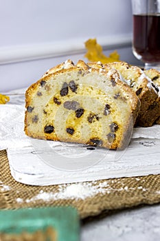 Slices of homemade raisin cake with black tea. Raisin bread cake. Breakfast concept. Rustic style. autumn still life