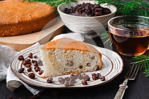 Slices of homemade raisin and orange loaf cake. Raisin bread cake. Breakfast concept