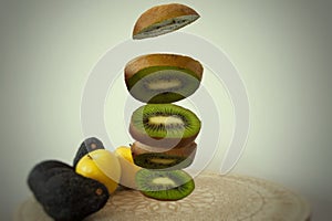 Slices of kiwi levitating photo