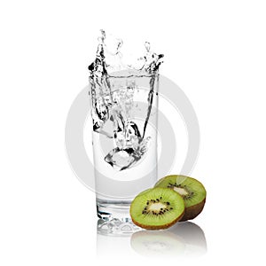 Slices of kiwi and water of glass