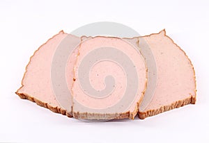 Slices of Leberkase on white background. It is a german speciality food. photo
