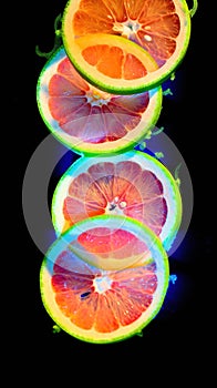 Slices of lemon, lime, orange and grapefruit .