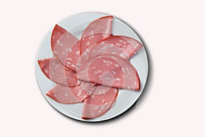 Slices of mortadella served with lemon .. top view.