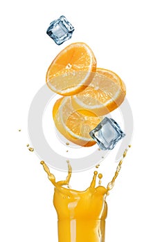 Slices of orange falling into juice splash