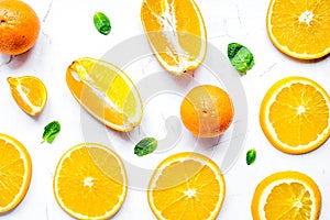 Slices for orange juice on white background top view pattern