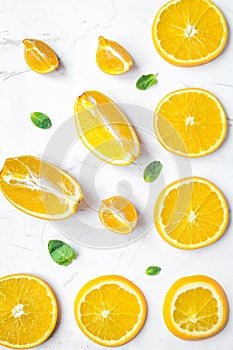 Slices for orange juice on white background top view pattern