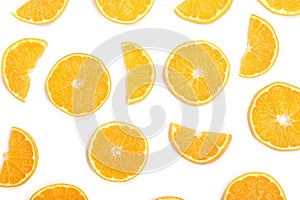 Slices of orange or tangerine on white background. Flat lay, top view. Fruit composition