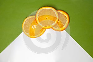 Slices of orange on two color background