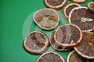 slices of oranges on green background