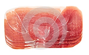 Slices of parma ham prosciutto isolated on white background. Slice of a prosciutto ham isolated