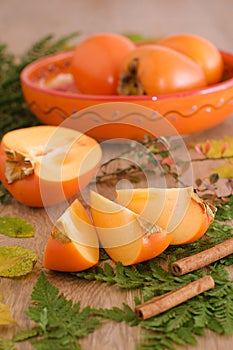 Slices of persimmon on a leaves