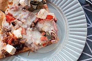 Slices of pizza with cheese with bell pepper and meat