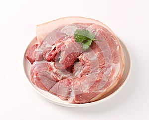 Slices of pork with rosemary isolated on white background