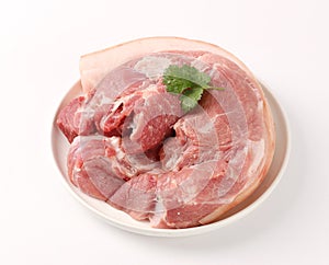Slices of pork with rosemary isolated on white background photo