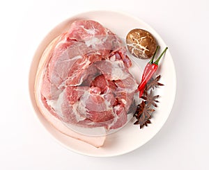 Slices of pork with rosemary  on white background