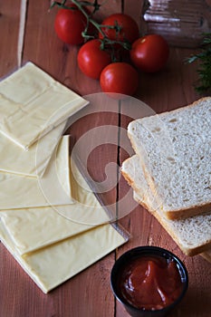 Slices of processed cheese with toast bread.