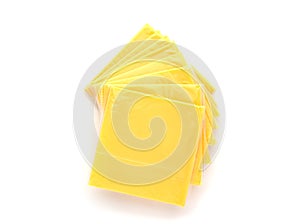 Slices of processed cheese on a white background.