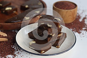 Slices of Ragi Halwa served in a round wooden tray