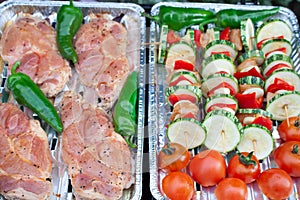 Slices of raw pork neck, hot green chilli pepper