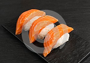 Slices of Raw Salmon Fillet on Black Background Mockup Top View