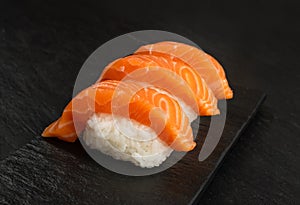 Slices of Raw Salmon Fillet on Black Background Mockup Top View