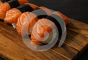 Slices of Raw Salmon Fillet on Black Background Mockup Top View