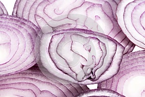 Slices of red onion on white background, close up
