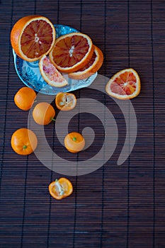 Slices of ripe orange on the saucer, close-up