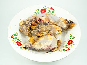 Slices of roasted chicken on plate