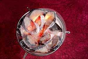 Slices of rohu fish on big sieve